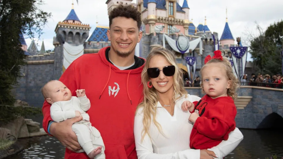 Patrick Mahomes, Brittany Mahomes with their children, Sterling and Bronze. Photo by Christian Thompson/Disneyland Resort via Getty Images.